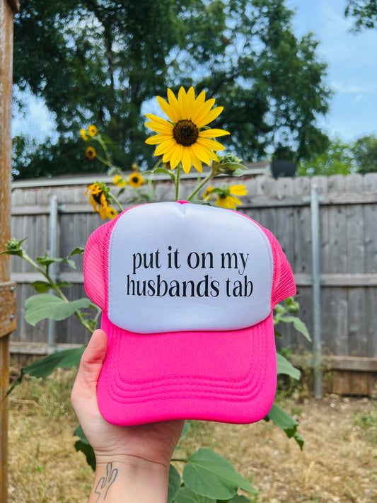 Put it on my Husbands Tab Trucker Hat